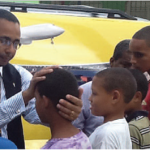 Pastor Jack Blesses Child in Salcedo